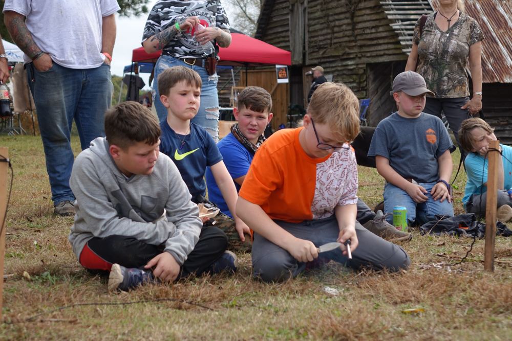 Kids at a carving class at a past Gathering